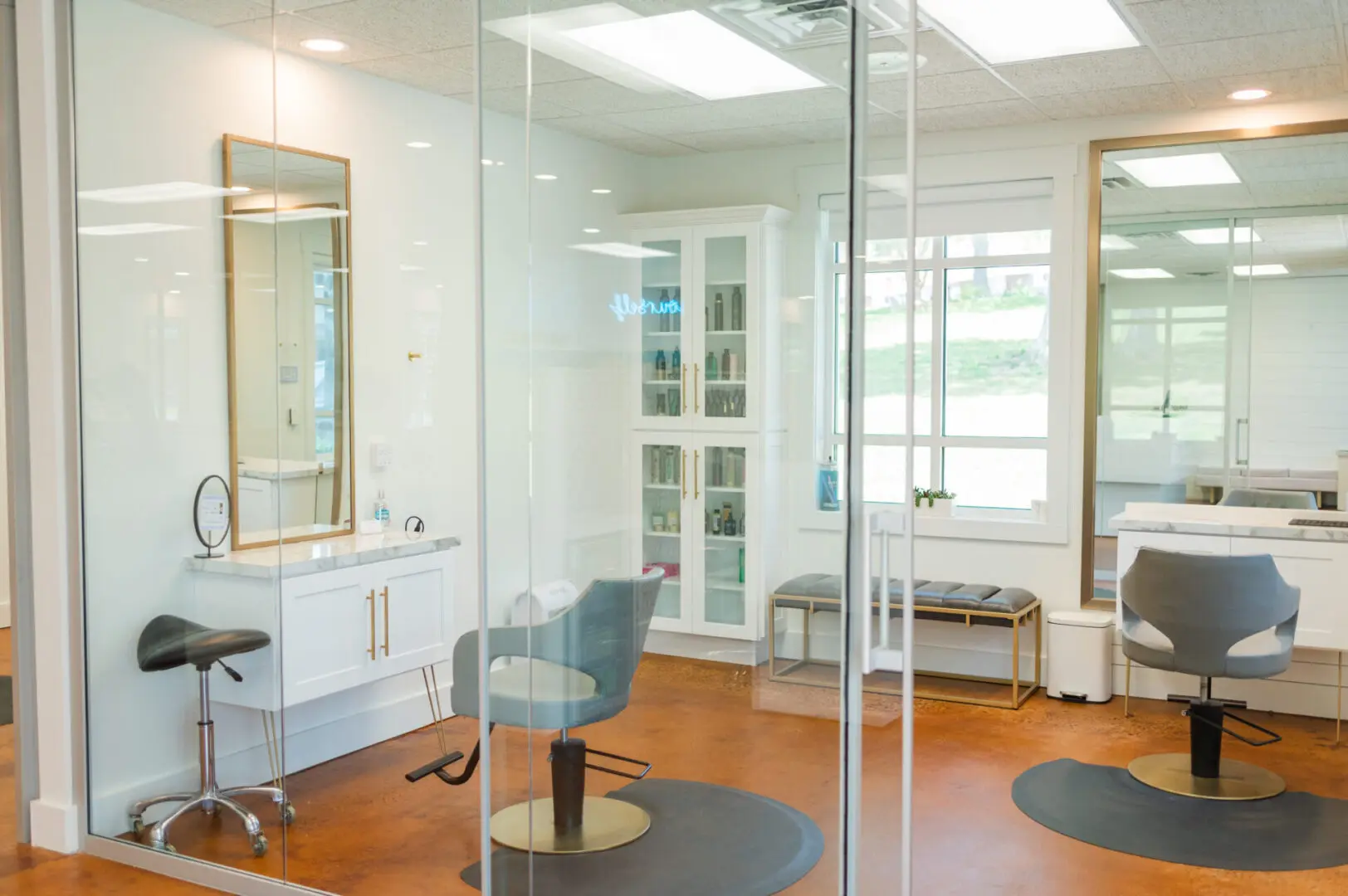 The Greenville Hair Bar Salon view through glass door