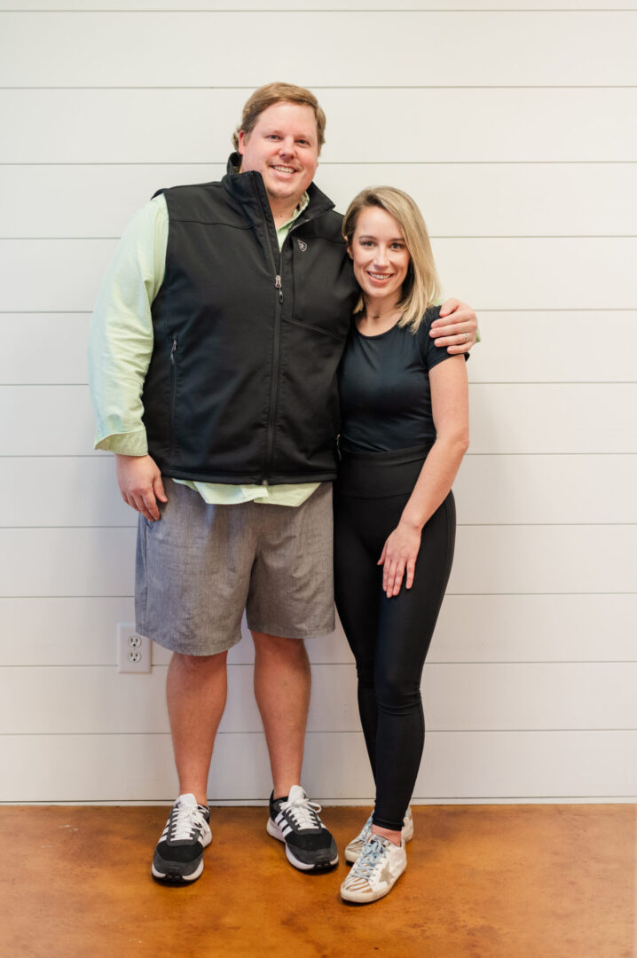 A man and woman standing next to each other.